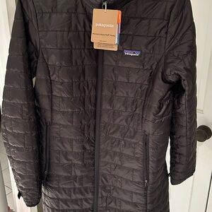 Patagonia Women's Black Puff long Jacket with Heineken Logo